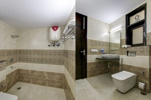 Bathroom features a large bathtub, separate shower area, and a mirror above the sink.
