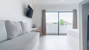 The Simore - Suite B | Living area | 25-inch LCD TV with cable channels