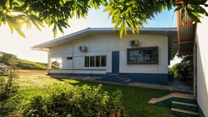 A modern two-story house with a flat roof, a front porch, and a small front yard. - Cozy 1-bed Apt in Whim Estate-near Scarborough (Scarborough)