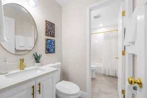 Shower, hair dryer, towels, shampoo