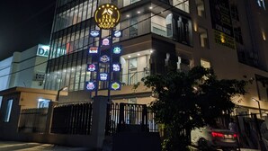 A multi-story building with illuminated signage, including "ANTIMATTER" and "ALL STAR CLUB". - All Starr Sports (Jaipur)