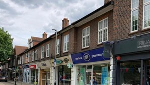 A street view with a pharmacy and a local store. - Apartment - Sleeps 2 & Great Transport Links (London)