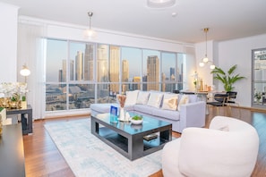 Deluxe Apartment | Living area | 55-inch Smart TV with cable channels - HomesGetaway-The Residences 3BR Downtown (Dubai)