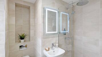 Shower, hair dryer, towels