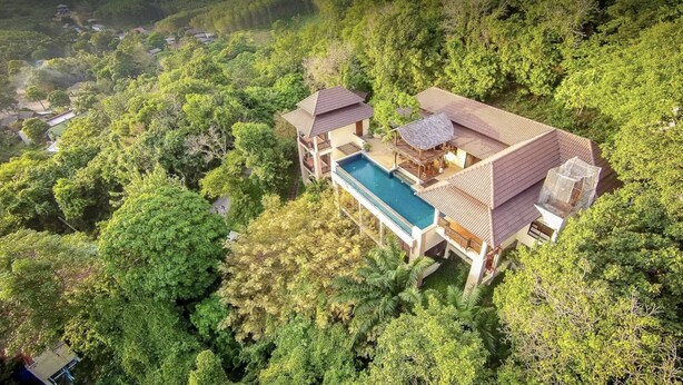 A large, two-story house with a swimming pool, surrounded by dense forest. - Private Pool Villa · Kantiang Bay Sea Views · 3 Bedrooms (Ko Lanta)