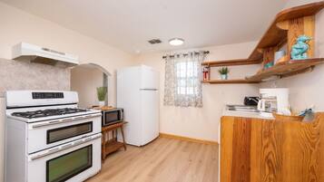 Fridge, microwave, toaster, cookware/dishes/utensils