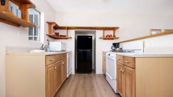 Microwave, coffee/tea maker, toaster, cookware/dishes/utensils