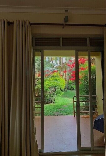  Quiet and peaceful hidden gem surrounded by lush greenery and vibrant flowers.
