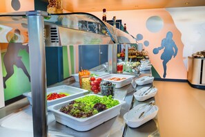 A buffet with various food items and utensils. - ibis Styles Batumi  (Batumi)