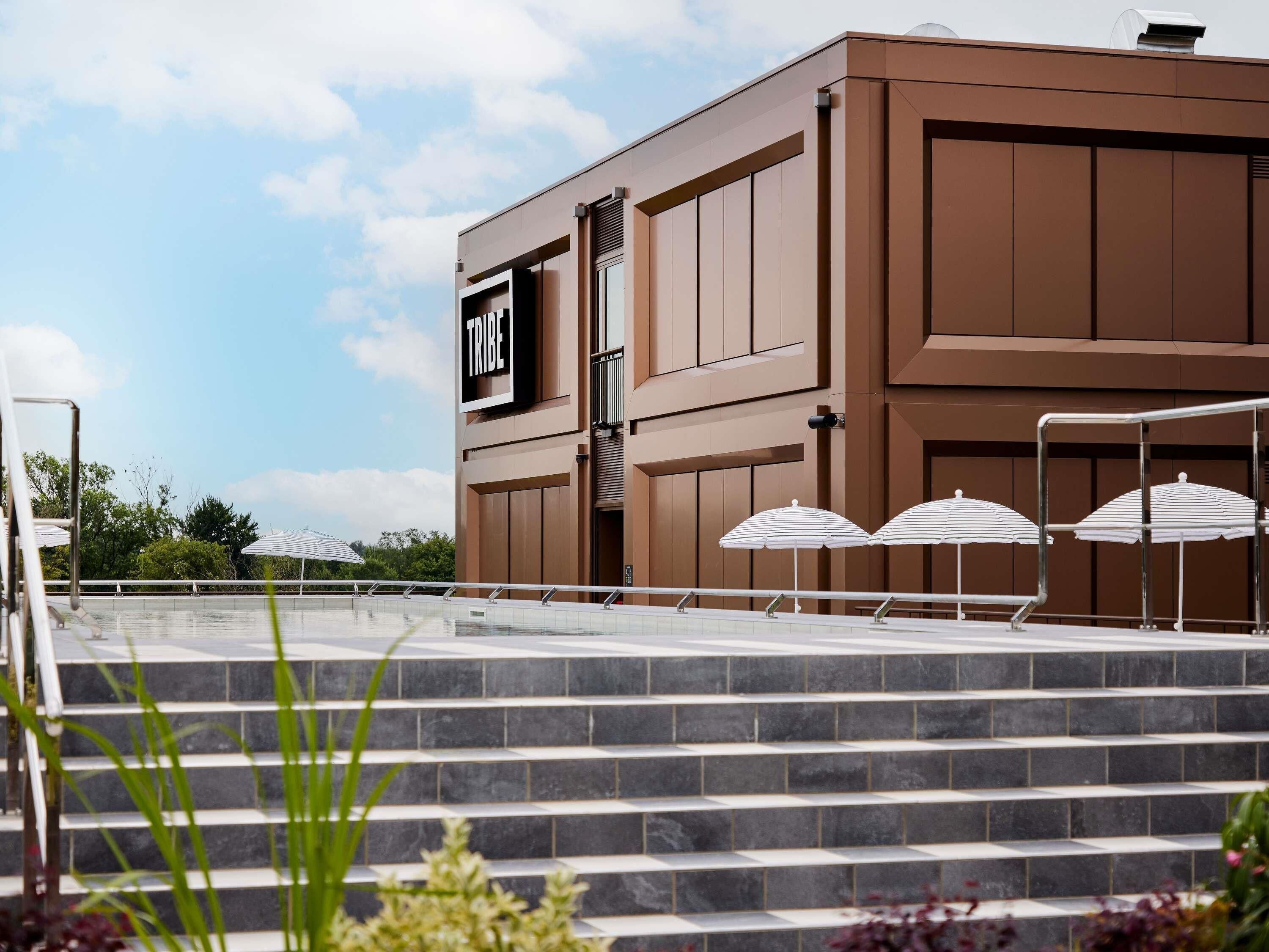 Seasonal outdoor pool, open 11:00 AM to 7:00 PM, pool umbrellas