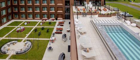 Seasonal outdoor pool, open 11:00 AM to 7:00 PM, pool umbrellas
