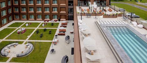 Seasonal outdoor pool, open 11:00 AM to 7:00 PM, pool umbrellas