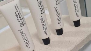 Four tubes of Antipodes hand and body lotion on a countertop. - Immaculate 1-bed Apartment in Milton Keynes (Milton Keynes)