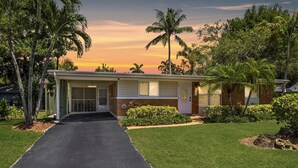 A single-story house with a front porch, a garage, and a well-maintained lawn.