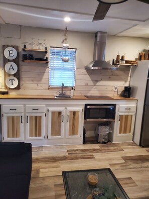 Fridge, microwave, stovetop, coffee/tea maker