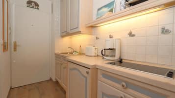 Fridge, coffee/tea maker, toaster, cookware/dishes/utensils