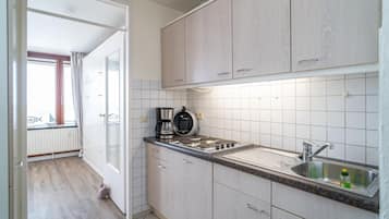 Fridge, coffee/tea maker, toaster, cookware/dishes/utensils