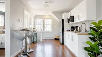 Fridge, microwave, stovetop, coffee/tea maker