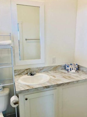 Shower, hair dryer, towels, soap