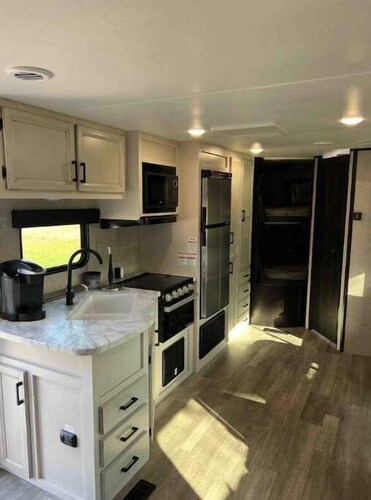 “Whooperazzi” The Sunrise Bay View Camper