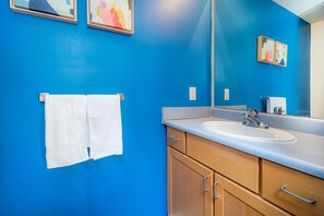 Shower, hair dryer, towels, shampoo