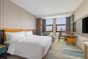 A hotel room with a large bed, a desk, a chair, and a TV. - Hotel Plume Chengdu, Tapestry Collection By Hilton (Chengdu)