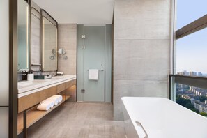 A modern bathroom with a large mirror, a bathtub, and a view of the city. - Hotel Plume Chengdu, Tapestry Collection By Hilton (Chengdu)