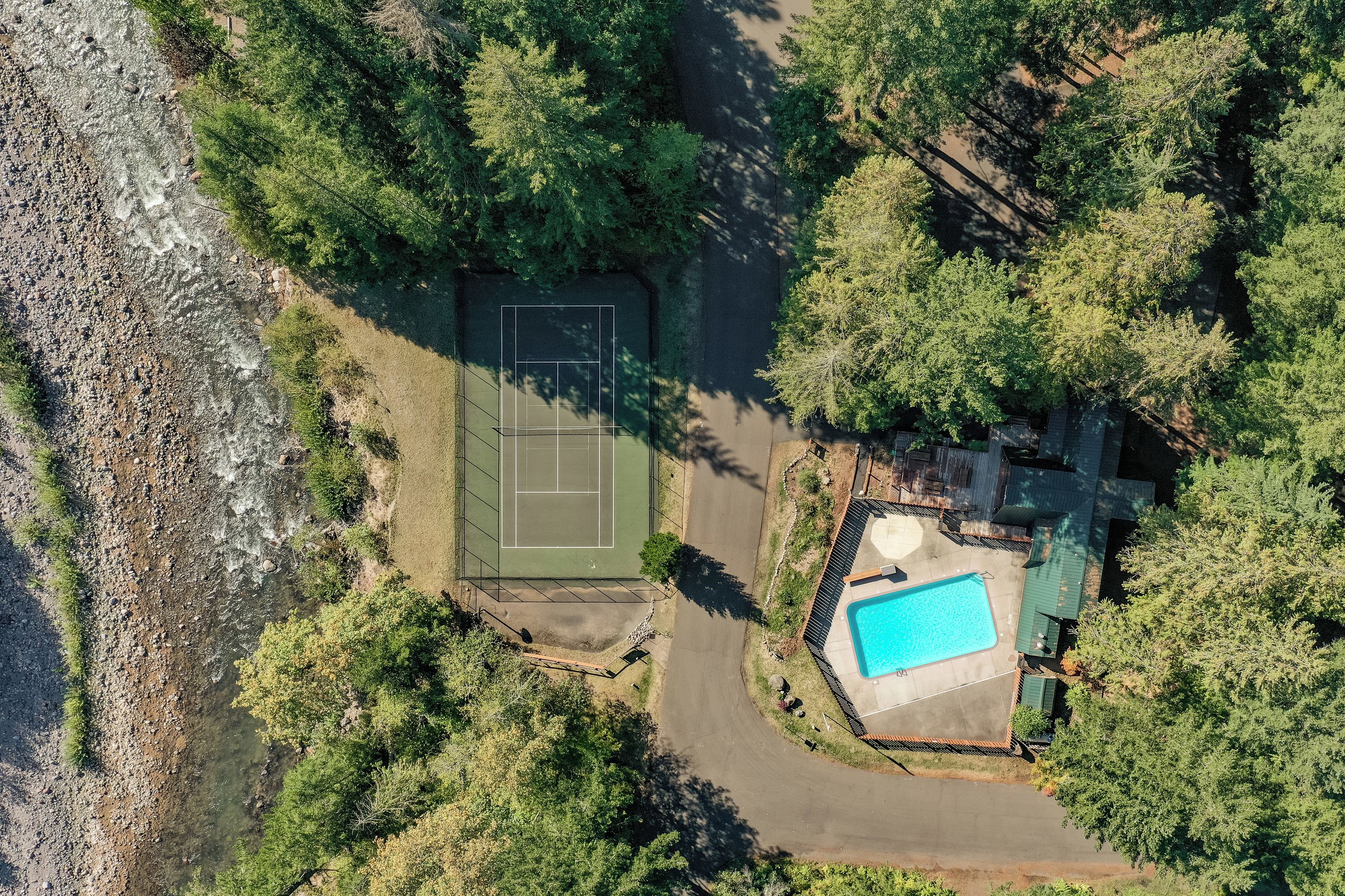 Community perks nearby: a shared pool, tennis court, and riverside views, all an easy walk from home.