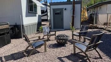 Enjoy a nice quiet evening by the fire. Laundry room is in the background.