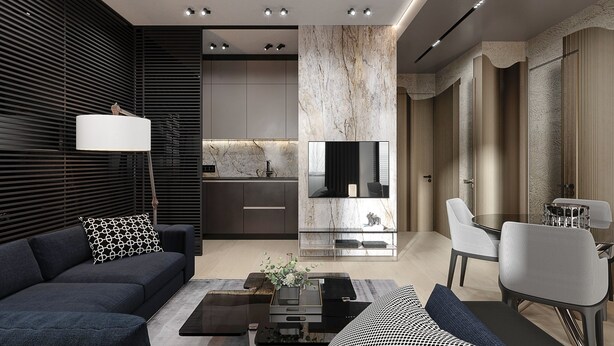 Una sala de estar moderna con un sofá oscuro, una mesa de centro y una zona de comedor con una silla y una mesa.