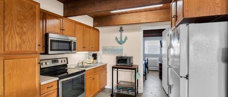 Fridge, microwave, oven, cookware/dishes/utensils