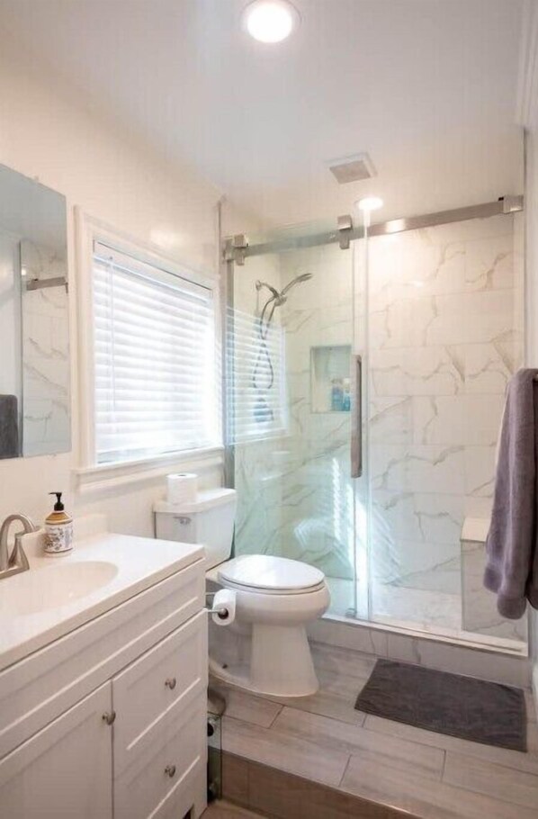 Shower, hair dryer, towels, soap