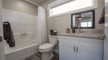 Shower, hair dryer, towels, shampoo