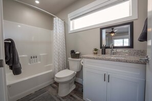 Shower, hair dryer, towels, shampoo