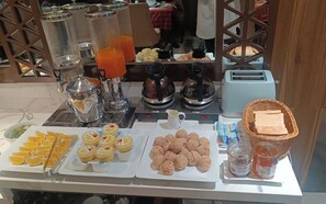 A breakfast buffet with various food items and beverages. - Ping Diamond Hotel (Hanoi)