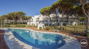 Relax by the serene pool surrounded by lush greenery and tranquil surroundings.