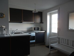 Fridge, microwave, cookware/dishes/utensils