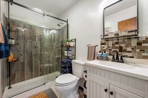 Shower, hair dryer, towels, shampoo