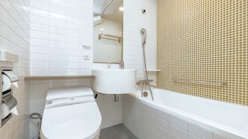 A modern bathroom with a toilet, sink, and shower.