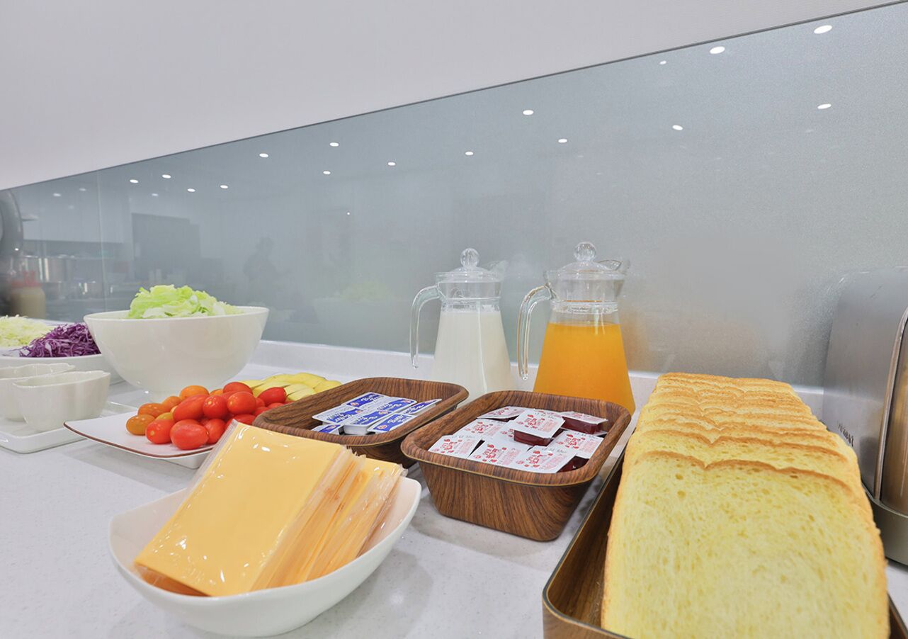 A breakfast buffet with various food items and beverages.