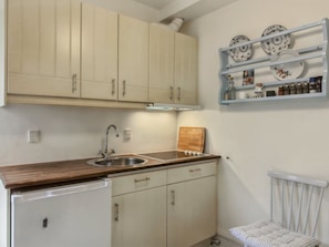 Fridge, high chair, cookware/dishes/utensils