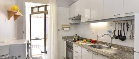 Fridge, microwave, oven, cookware/dishes/utensils