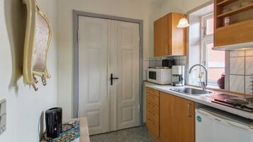 Fridge, microwave, highchair, cookware/dishes/utensils