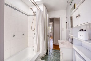 Enjoy a refreshing shower in this bathroom with a walk-in shower and handheld showerhead.