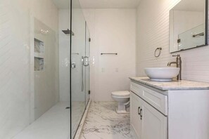 Shower, hair dryer, towels