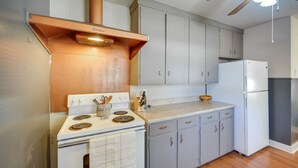 A kitchen with a stove, oven, cabinets, and a refrigerator. - Pet-Friendly Brady Vacation Home Near Wineries! (Brady)