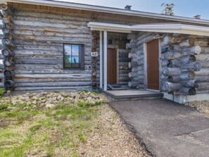 A log cabin with a porch, a door labeled 'A2', and a window. - Nilikuru a 2 by Interhome (Inari)