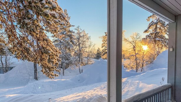A snowy landscape with a clear view of a snow-covered road and trees. - Saariseläntie 8 a 8 by Interhome (Inari)