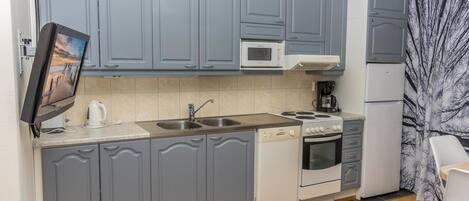 Een koelkast, een microgolfoven, een vaatwasser, een broodrooster