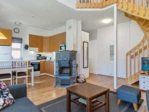 Relax in a cozy living area with a comfortable sofa and fireplace.